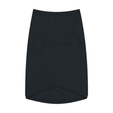 A playful dog wearing a surfing bunny tank top featuring a colorful surfboard design