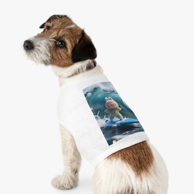 A playful dog wearing a surfing bunny tank top featuring a colorful surfboard design
