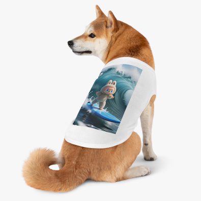 A playful dog wearing a surfing bunny tank top featuring a colorful surfboard design