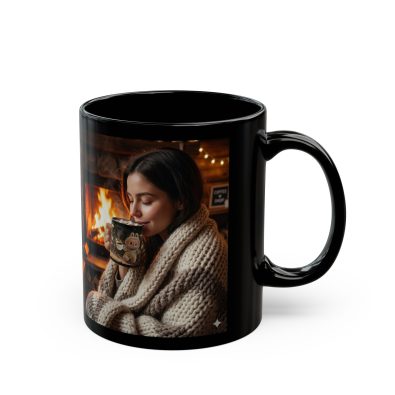 A black ceramic mug featuring a festive bonfire lady illustration, perfect for hot cocoa during the holidays