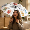 Cute Labubu Umbrella – Foldable Semi-Automatic Rain A bright pink Labubu umbrella opened in a sunny street, showcasing its foldable design and semi-automatic opening mechanism.