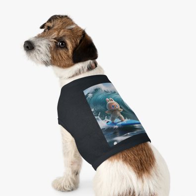 A playful dog wearing a surfing bunny tank top featuring a colorful surfboard design