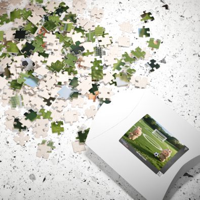 A colorful jigsaw puzzle featuring cute animal characters playing soccer, designed for children