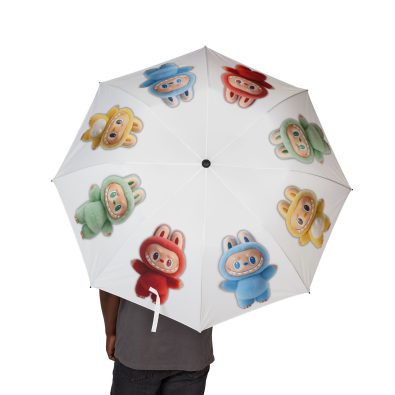 A bright pink and blue Labubu umbrella unfolding automatically in a gentle rain