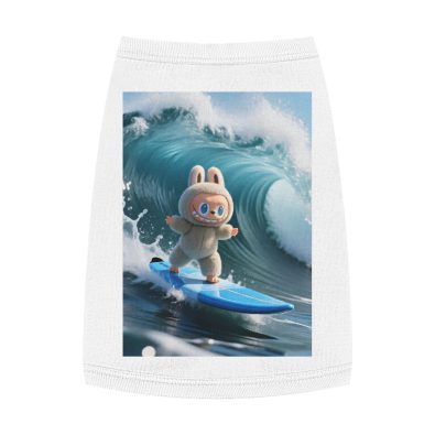 A playful dog wearing a surfing bunny tank top on a beach